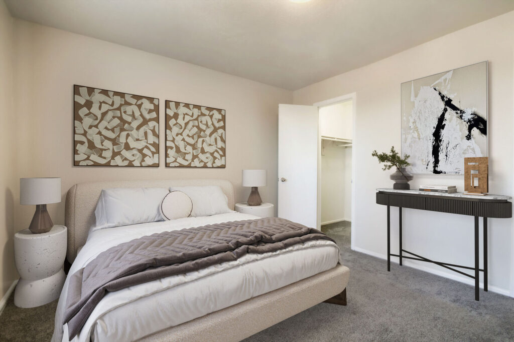 carpeted bedroom with walk in closet