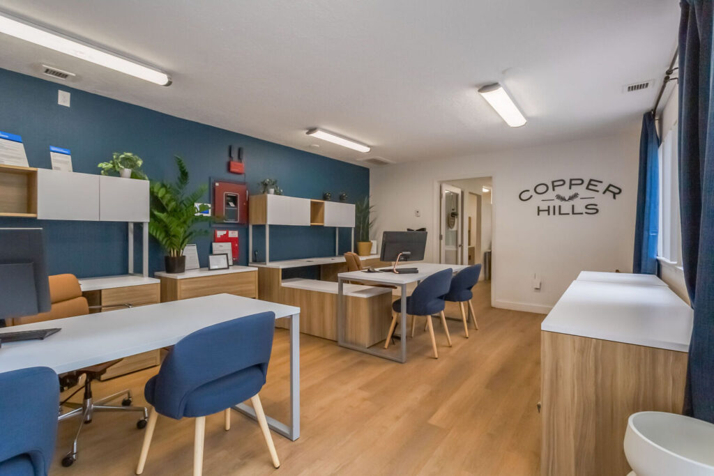Leasing office with desk and chairs at Copper Hills apartments in ABQ, NM